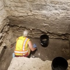 Archaeologist inside an excavation unit