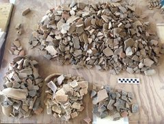 Small piles of ceramic sherds