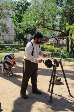 Living historian welding in encampment