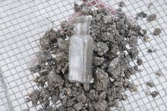 Glass bottle found inside an archaeology excavation area