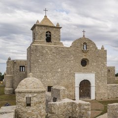Stone mission with low barrack on two sides