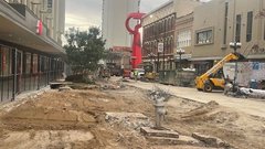 Dirt area of a street under construction in an urban area