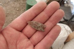 Small guerrero point artifact in the palm of a hand