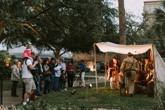 Visitors watch a dramatic performance at the Alamo.