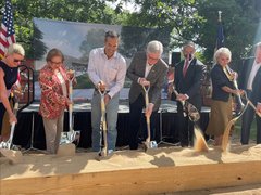 A row of Alamo dignitaries with shovels for a ceremonial ground breaking