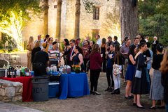 Large group of guests enjoying an event in Alamo Gardens