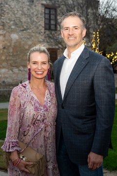 Woman and a man smiling at an outdoor event