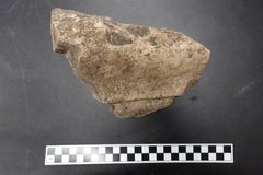 Limestone molding next to a ruler for size