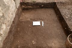 Flat dirt surface at the bottom of an excavation unit