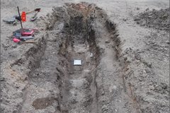 Long, narrow dug out area of archaeology excavation