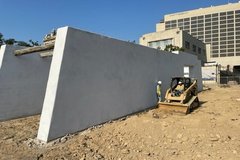 Dirt construction area with truck next to Mission Gate