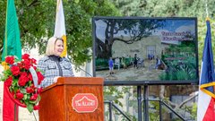 Texas Land Commissioner Dawn Buckingham, M.D. speaking at a podium