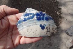 Fragment of puebla blue on a white ceramic sherd