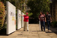 Visitors walk next to the Wall of History.