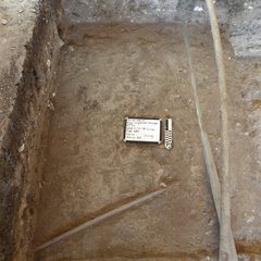 Dirt surface at the bottom of an excavation unit