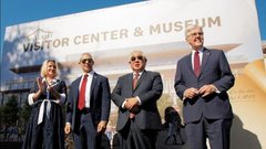 Commissioner Buckingham, Mayor Nirenberg, Judge Sakai, and Lt. Governor Patrick on a stage in front of a musuem facade