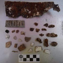 Rock fragment artifacts next to ruler to show size