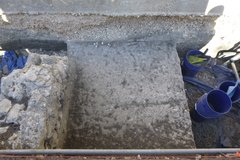 Overview of concrete sidewalk inside an excavation unit