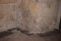 Black paper on the floor on the Alamo Confessional catches fragments of limestone from the walls.