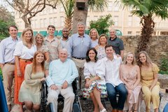 Group gathered for a photo in Alamo Hall Patio