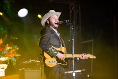 Charley Crockett performs on outdoor pavilion stage