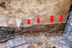 Red arrows pointing to monel plate