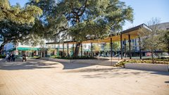 Paved area leading to the back of pavilion stage in an outdoor community park