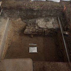 Inside an excavation unit with a limestone footer