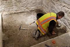 Archaeologist inside an excavation unit
