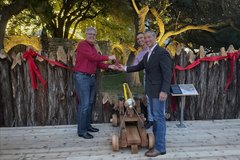 Three men cutting the ribbon on the new Palisade Exhibit