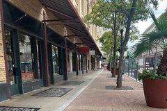 Red brick sidewalk area with tree planters
