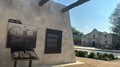 Wall of Mission Gate with Alamo Church to the right