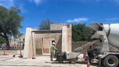 Construction worker outside of Mission Gate site with a truck