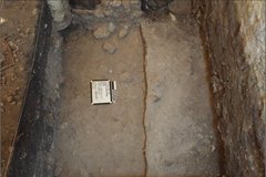 Two dirt levels at bottom of an excavation unit