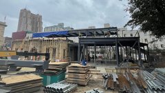 Construction on Alamo Education Center with materials outside building
