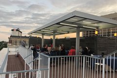 People on a terrace nearing sunset