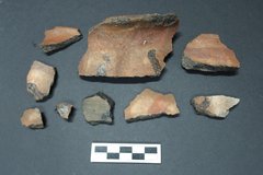 Goliad ceramic fragments next to a ruler for size