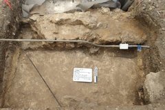 Tube along side of interior excavation unit