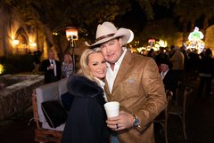 Man in cowboy hat and woman smiling in Alamo Gardens