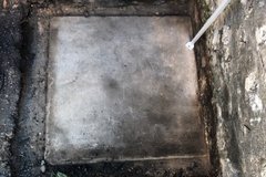 Concrete slab under the surface in an excavation unit