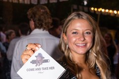 Bride holding a napkins that says Come and Take Her, Please!