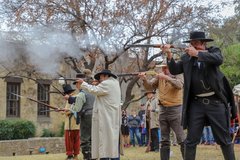 Living historians firing muskets