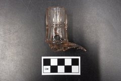 Broken top of glass bottle found in excavation unit
