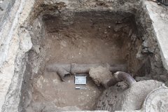 Clay pipe inside an excavation unit