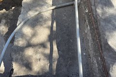 Two pipes crossing inside an excavation unit