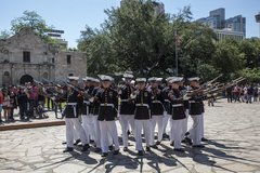 Marines execute their “bursting bomb” sequence in front of the Alamo