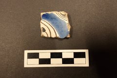 Square fragment of a ceramic with blue coloring