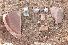Stone artifacts on a sandy surface