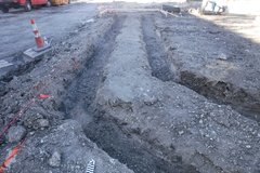 Two L shaped rows of dug out dirt in construction zone