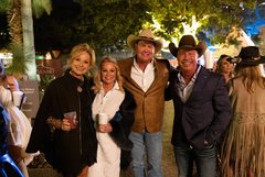 Group of four men and women in Alamo Garden, both men wearing cowboy hats